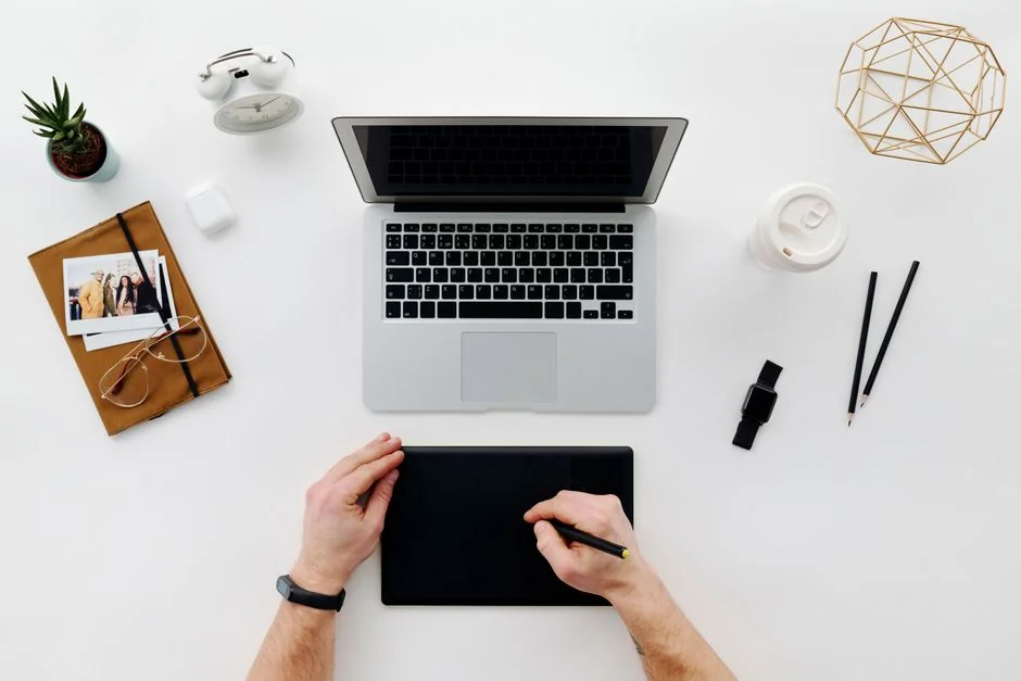Laptop screen showing Pexels website, ideal for stock photo needs.